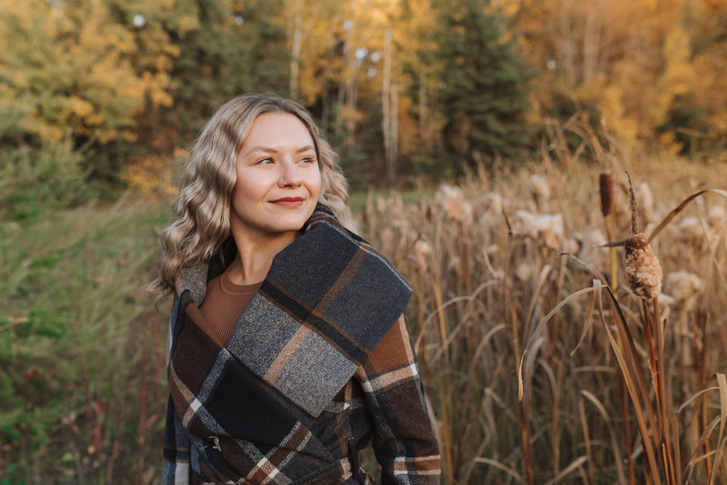 a photo of Nicole at the trout pond near Candle Lake